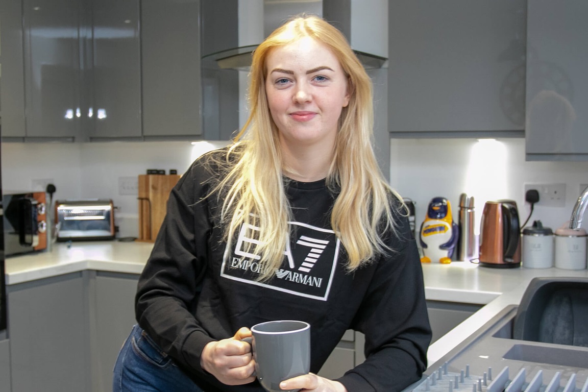 MAIN IMAGE Caption Having a cup of tea in her new modern kitchen