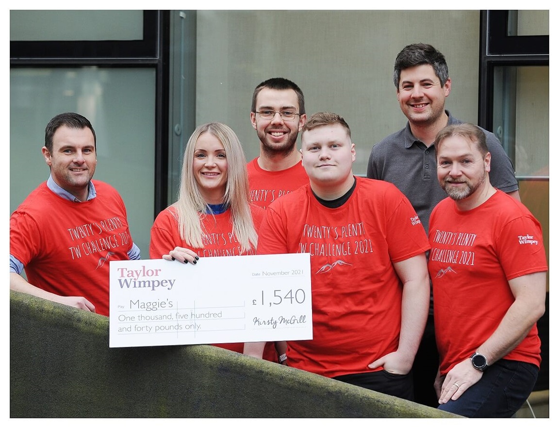 Group of Taylor Wimpey employees with donation cheque for Maggie's Fife.
