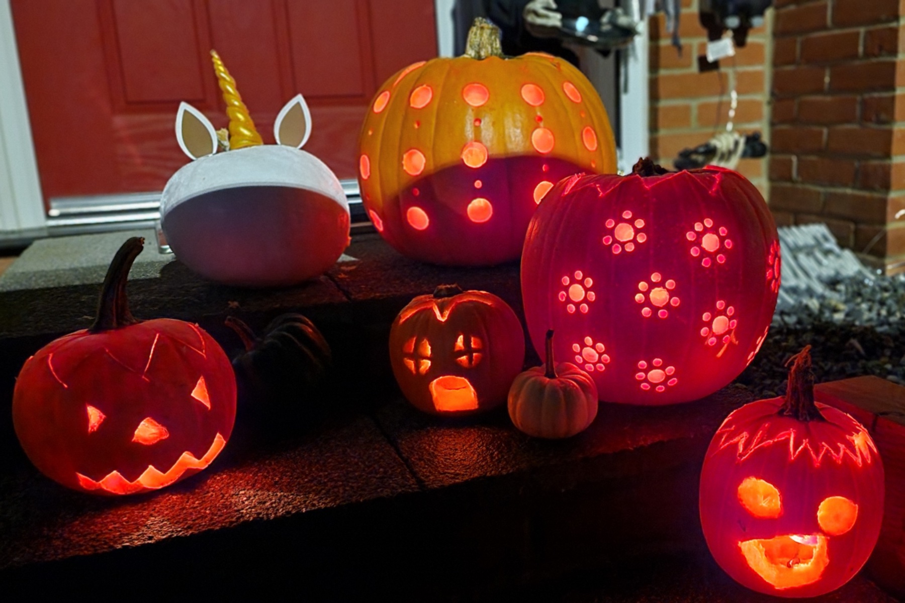 Finished lit pumpkins on the doorstep