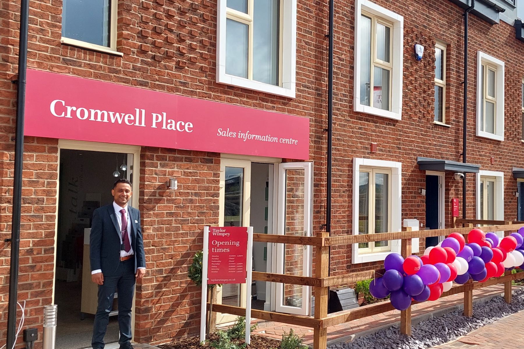 Our sales team outside with balloons