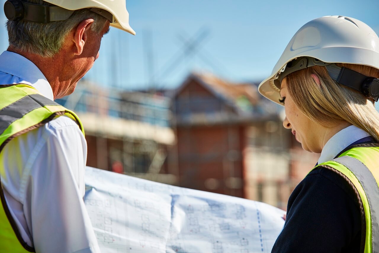 Man and woman looking at plans