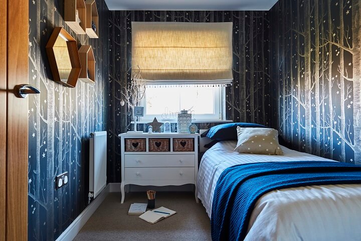 Bedroom with blue forest wallpaper