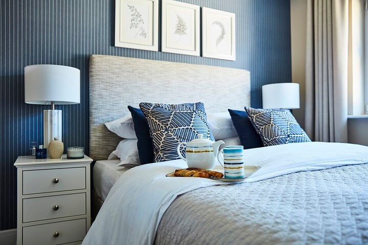 Bedroom with blue and white stripped wall