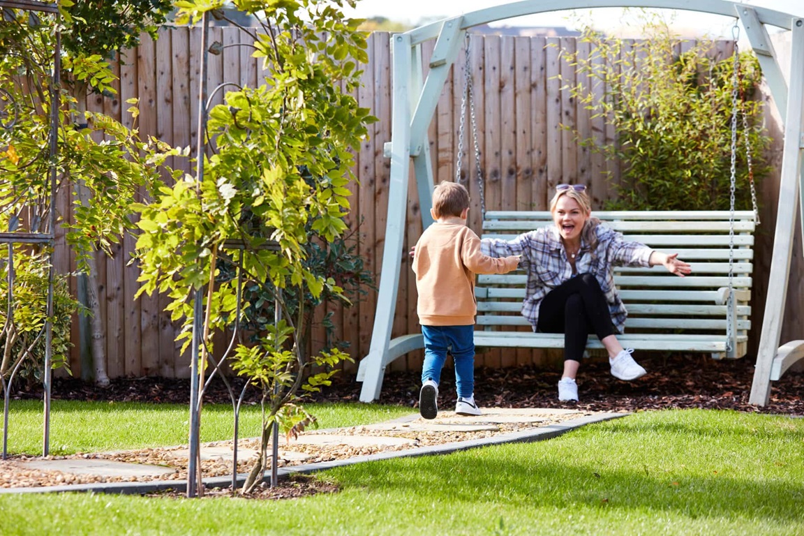 Mother and son in garden
